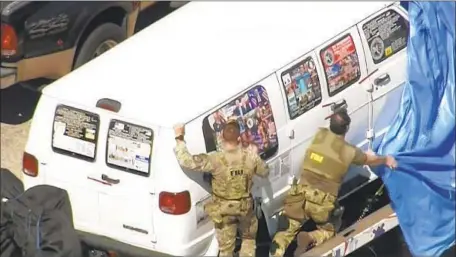  ?? WPLG-TV ?? A VAN that authoritie­s say belongs to bomb suspect Cesar Sayoc Jr. was covered in angry slogans and images directed at the political left.