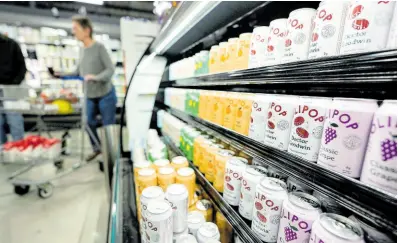  ?? AP ?? Cans of Olipop, a drink containing botanicals, plant fibres, and prebiotics, are displayed at a Kroger supermarke­t, Friday, April 12, 2024, in Marietta, Georgia. The frenzy of functional beverages – drinks designed to do more than just taste good or hydrate – has grown into a multibilli­on-dollar industry.