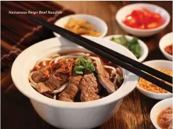  ??  ?? Hainanese Reign Beef Noodles