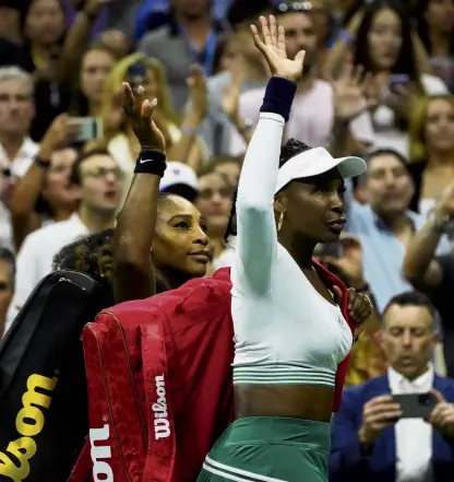  ?? PHOTO: USA TODAY SPORTS ?? No fairytale . . . Serena (left) and Venus Williams wave to the crowd after losing to Lucie Hradecka and Linda Noskova in the first round of the US Open women's doubles at USTA Billie Jean King National Tennis Centre in New York yesterday.