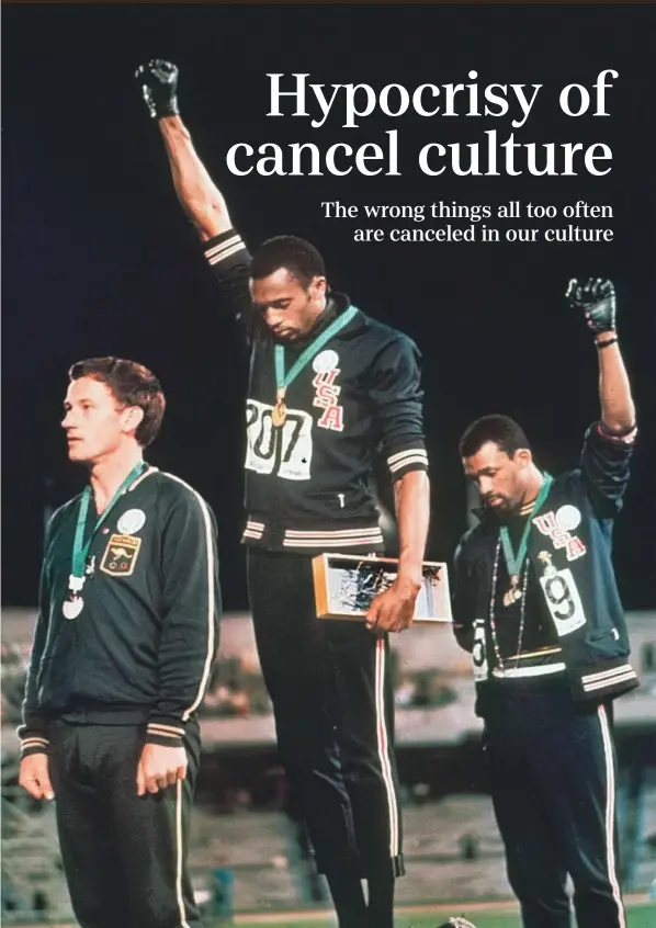  ?? ASSOCIATED PRESS ?? On Oct. 16, 1968, American athletes Tommie Smith, center, and John Carlos, right, raised their black-gloved fists on the medals stand as a symbol of protest more than 50 years ago at the Mexico City Olympics, creating an iconic image from the games. Australia’s silver medalist Peter Norman is at left.