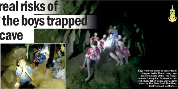  ??  ?? Boys from the under-16 soccer team trapped inside Tham Luang cave greet members of the Thai rescue team in Chiang Rai, Thailand, in this still image taken from a July 3, 2018 video by Thai Navy Seal. Thai Navy Seal/Handout via Reuters