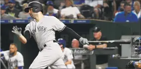  ?? Ed Zurga / Getty Images ?? Neil Walker hits an RBI single in the sixth inning against Kansas City on Friday.