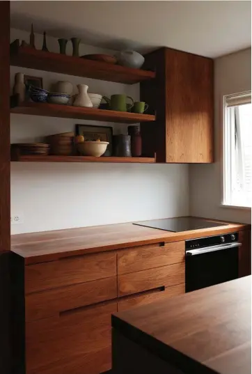  ??  ?? Appliances Fisher & Paykel rangehood, induction hob, oven, integrated fridge and DishDrawer Benchtop Solid walnut sealed with Osmo Polyx oil Cabinetry Walnut cabinetry designed by Nat Cheshire and Ian Scott, fabricated by Essex Cabinet Makers...