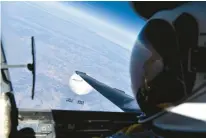  ?? DEPARTMENT OF DEFENSE ?? A U.S. Air Force U-2 pilot looks down at a suspected Chinese surveillan­ce balloon as it hovers over the United States on Feb. 3.