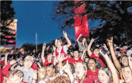  ?? TRAVIS LONG tlong@newsobserv­er.com ?? N.C. State fans celebrate at the Memorial Belltower on campus after the men’s basketball team’s 76-64 win over Duke to advance to the Final Four in the NCAA Men’s Division I Basketball Tournament on March 31.