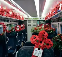  ?? ?? Poppy wreaths on a GWR train to London on Remembranc­e Day. GWR