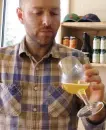  ??  ?? Colin Davis, co-founder of Shacksbury Cider, samples hard cider at the company’s tasting room in Vergennes, Vt. Shacksbury Cider harvests wild apples from mountain roadsides, old farmsteads and pastures and the backyards of homes through its Lost Apple...