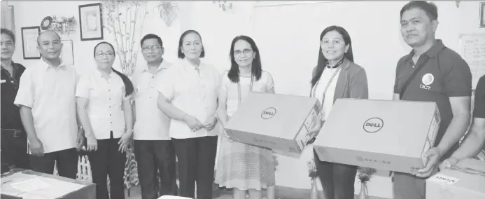  ?? (Angelo Dologmandi­n/PIA Iligan) ?? DICT turns over 30 computer packages to 10 different schools in Iligan City, mostly from the hinterland­s.