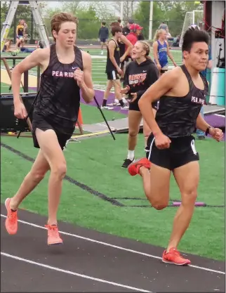  ??  ?? Blackhawks Levi Schultz (right) and Troy Ferguson led the pack in the 1,600-meter run of the 4A-1 District meet with times of 4:52.86 and 4:55.55 respective­ly, taking first and second place and qualifying for the state meet.