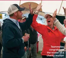  ??  ?? Teammates congratula­te the winner of a charity auctionAks­el Solberg helps raise the main underway