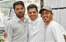  ?? Ahmed Kutty/Gulf News ?? Mohammad Kunhi Mayyala (centre) celebrates his good fortune with his co-workers Dawood K.B. and Enayathull­ah at their clothing store in Baniyas yesterday.