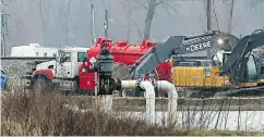  ?? DAVID CARSON / ST. LOUIS POST-DISPATCH VIA AP ?? Cleanup efforts continue at an oil leak near St. Louis.