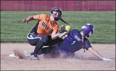  ?? Staff photo/John Zwez ?? A Minster infielder catches the ball as a runner for Fort Recovery slides into second base during Tuesday’s Division IV district semifinal at Wapakoneta. See more photos at theevening­leader.com.