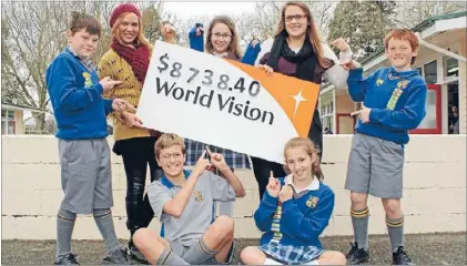  ??  ?? The top fundraiser­s: Back from left: Blair Pearce, Charney Rooza (World Vision), Ashlynne MacWilliam, Aleisha Hadwin (World Vision) and Locryne Tiddy. Front: Caleb and Sarah McDonnell.