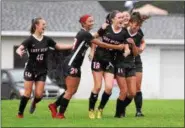  ?? AUSTIN HERTZOG - DIGITAL FIRST MEDIA ?? Boyertown’s Maggie Kiene (18) is congratula­ted by teammates after scoring a goal against Pennsbury.