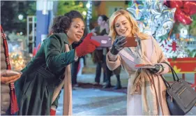  ??  ?? Tamara Austin and Pickler on one of the festively decorated sets of “Christmas at Graceland.”