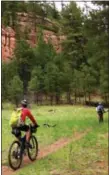  ?? SCOTT MORRIS VIA AP ?? In this photo provided by Scott Morris, Lee Blackwell and Chad Brown are shown bikepackin­g a segment of the Arizona Trail, south of Flagstaff, Ariz.