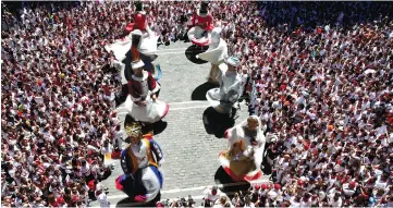  ??  ?? ‘Gigantes’ (Giants) dance in front of Pamplona’s town hall during a farewell ceremony on the last day of San Fermin festival’s ‘Comparsa de gigantes y cabezudos’ (Parade of the giants and the big heads) in Pamplona on July 14. — Reuters photo