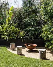  ??  ?? 1. Log seating encircles a Bunnings fire pit in a corner of the backyard.