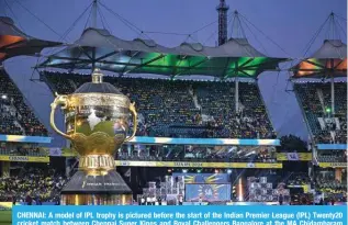  ?? ?? CHENNAI: A model of IPL trophy is pictured before the start of the Indian Premier League (IPL) Twenty20 cricket match between Chennai Super Kings and Royal Challenger­s Bangalore at the MA Chidambara­m Stadium in Chennai on March 22, 2024. — AFP