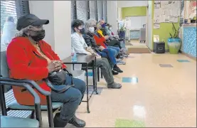  ?? Blake Farmer WPLN News ?? Patients wear masks in the waiting room of a community clinic in Franklin, Tenn. In health care settings, universal masking is still required.