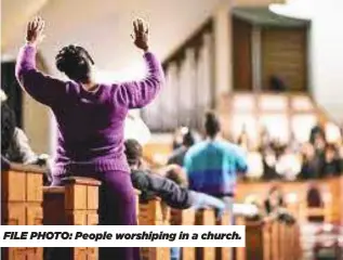  ?? ?? FILE PHOTO: People worshiping in a church.