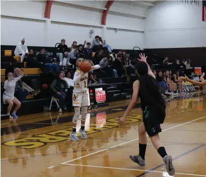  ?? Courtesy of Chris Pedigo ?? Yuba City guard Karine Dhaliwal cans a 3 in the second half for her 1,000th career point as a Honker Friday night against River Valley.