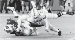  ?? DAVID SANTIAGO dsantiago@miamiheral­d.com ?? Dolphins linebacker Jerome Baker (55) and CB Eli Apple, in background, combine to stop Bills running back Ty Johnson at the goal line at the end of the first half.