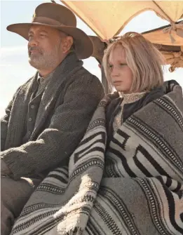  ?? BRUCE TALAMON/UNIVERSAL PICTURES ?? Tom Hanks plays a Civil War veteran returning a 10-year-old girl (Helena Zengel) home in “News of the World.”