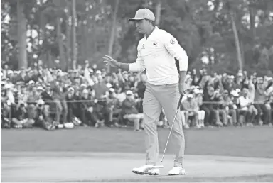  ??  ?? ROB SCHUMACHER/THE REPUBLIC Rickie Fowler walks off the 18th green during the final round of the Masters at Augusta National Golf Club. Fowler closed with a 67 to finish in second place.