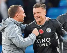  ??  ?? That’s my boy: Leicester manager brendan rodgers (left) congratula­ting Jamie vardy after the striker scored against Crystal Palace on nov 3. — aFP