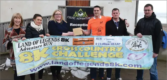  ??  ?? Nikki Reddy from Celtic Adventures presents a voucher to the value of €1500 to Nicola, Jamie and Kevin Bull of team Bull Call who were the winning team for the third year in a row in the Gary Kelly Cancer Support Centre’s Land of Legends Adventure run...