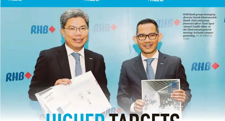  ?? PIC BY OWEE AH CHUN ?? RHB Bank group managing director Datuk Khairussal­eh Ramli (left) and group financial officer Tuan Syed Ahmad Taufik Albar at the 52nd annual general meeting in Kuala Lumpur yesterday.
