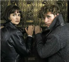  ??  ?? Katherine Waterston and Eddie Redmayne in a scene from Fantastic Beasts 2.