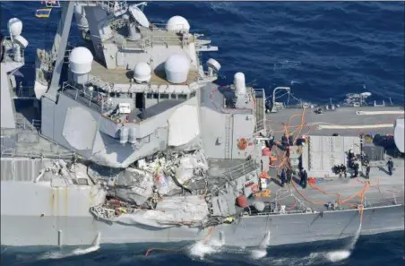  ?? IORI SAGISAWA — KYODO NEWS VIA AP ?? The damage of the right side of the USS Fitzgerald is seen off Shimoda, Shizuoka prefecture, Japan, after the Navy destroyer collided with a merchant ship, Saturday, . The U.S. Navy says the USS Fitzgerald suffered damage below the water line on its starboard side after it collided