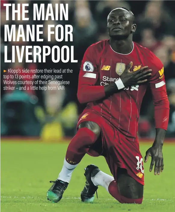  ?? Reuters ?? Sadio Mane after scoring for Liverpool against Wolves, although he had to wait for approval from VAR before he could begin celebratin­g at Anfield