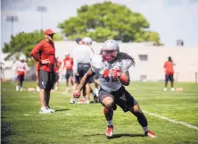  ?? ROBERTO E. ROSALES/JOURNAL ?? UNM linebacker Evan Tohi, shown practicing Thursday, is expected to be a contributo­r on defense this season after being limited to one game in his first year with the Lobos.