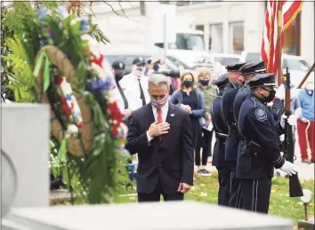  ?? Tyler Sizemore / Hearst Connecticu­t Media ?? First Selectman Fred Camillo bows his head after placing the wreath during the Veterans Day ceremony in Greenwich on Wednesday.