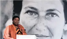  ?? | THIBAULT CAMUS REUTERS African News Agency (ANA) ?? CAMEROON activist Aissa Doumara Ngatansou delivers a speech at Elysee Palace, in Paris, yesterday. The inaugural Simone Veil Prize of the French Republic was awarded to Ngatansou by President Emmanuel Macron in front of portrait of Veil, the revered politician and Holocaust survivor who died in 2017. Ngatansou’s organisati­on helps victims of rape and forced marriage in her country.