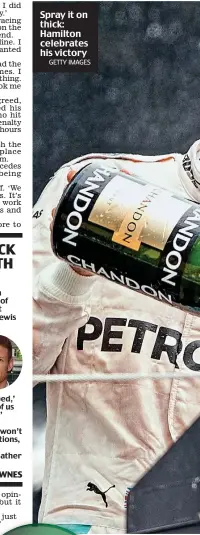  ?? GETTY IMAGES ?? Spray it on thick: Hamilton celebrates his victory