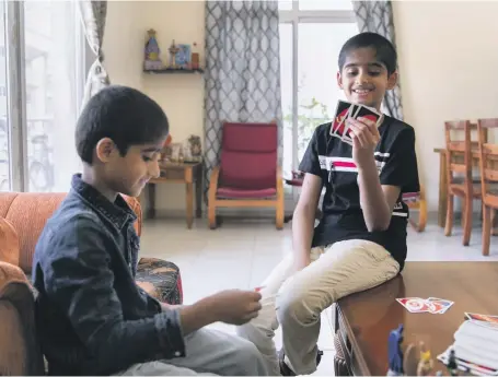  ?? Reem Mohammed / The National ?? Rishi, 9, and Rohan, 6, had their hair shaved for charity. But first, for it to be of the required length of at least 30 centimetre­s, they had to grow it for 18 months, below. They were the only boys to take part in their school’s appeal