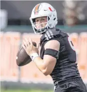  ?? AL DIAZ adiaz@miamiheral­d.com ?? Hurricanes quarterbac­k Tyler Van Dyke sets up to pass during practice drills at Greentree Practice Field.