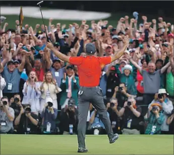  ?? Matt Slocum Associated Press ?? TIGER WOODS ENDED an 11-year major championsh­ip drought when he won his fifth Masters last year. CBS will show the final round Sunday, with Jim Nantz discussing it with Woods from their homes.