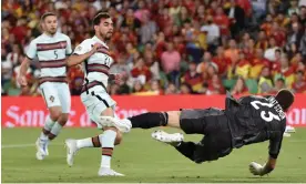 ?? Quicler/AFP/Getty Images ?? Ricardo Horta slots the ball past Unai Simón to equalise for Portugal. Photograph: Cristina