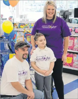  ?? SAM MCNEISH/THE TELEGRAM ?? Nathan Gibbons, 7, poses with his parents Eugene and Leanne prior to kicking off his Starlight Foundation 3-Minute Dash held on Tuesday morning at Toys ‘R’ Us on Kenmount Road.