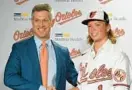  ?? SUN LLOYD FOX/BALTIMORE ?? Orioles executive vice president and general manager Mike Elias, left, said Friday that he “wouldn’t rule it out”when asked whether top prospect Jackson Holliday, right, could play for Baltimore in 2023.