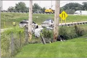  ?? NATALIE JOVONOVICH / STAFF ?? Ohio State Highway Patrol officials investigat­e a fatal crash along eastbound Interstate 70 in Huber Heights on Wednesday. Troopers say the car ran a red light and crashed into a utility pole.