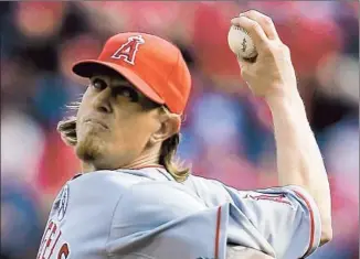  ?? Al Behrman Associated Press ?? ANGELS ACE Jered Weaver doesn’t throw very hard anymore but baff les hitters with deception and pinpoint control, as he did against the Cincinnati Reds in the season opener.