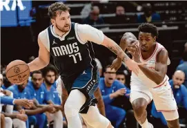  ?? Elizabeth Conley/Staff photograph­er ?? Mavericks guard Luka Doncic, left, scored 47 points in last week’s 125-107 win over the Rockets, which began the team’s current four-game losing streak.